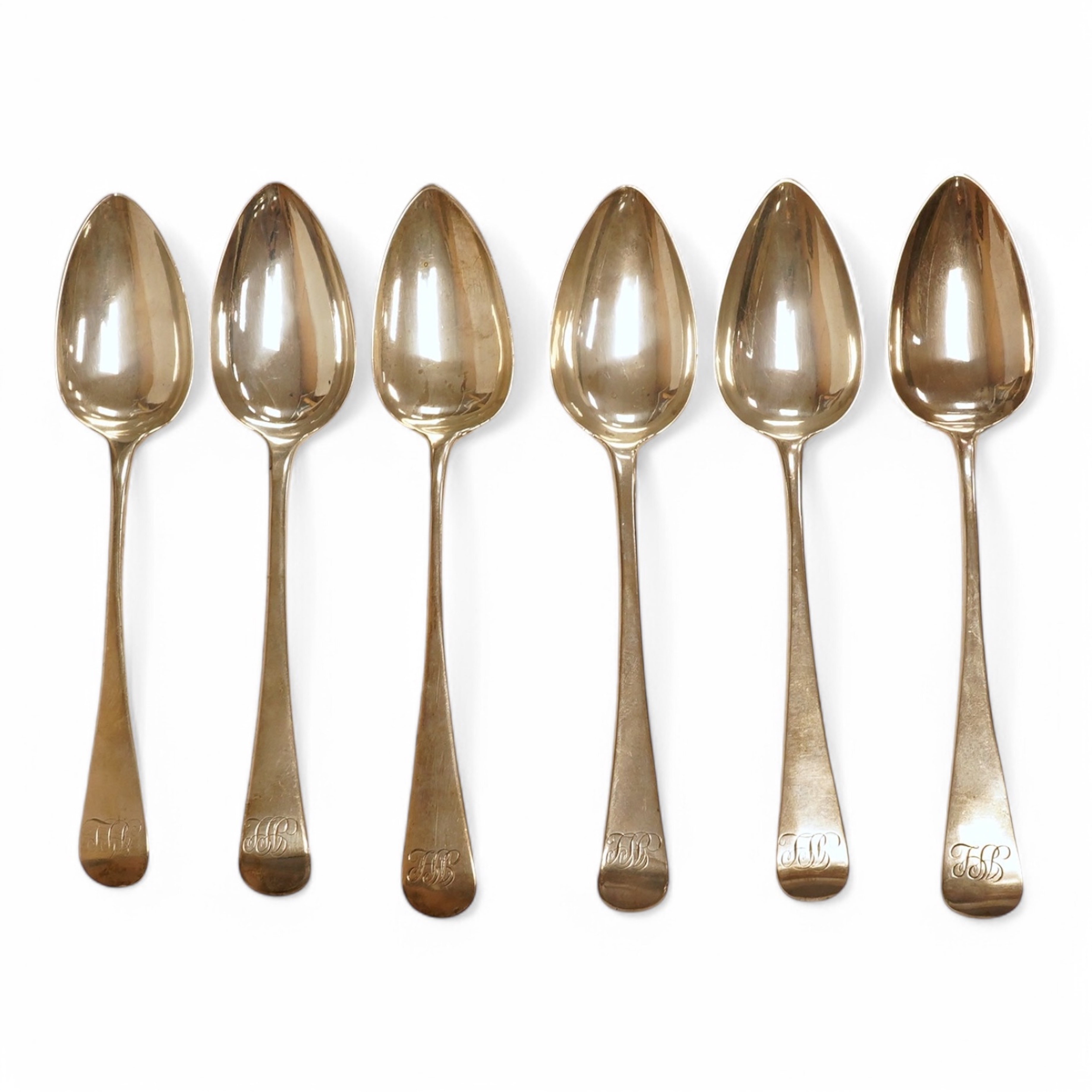 A set of six George III provincial silver table spoons by William Welch II, Exeter, 1807/8 & 1810, with engraved initials, 23cm, 12oz. Condition - fair to good